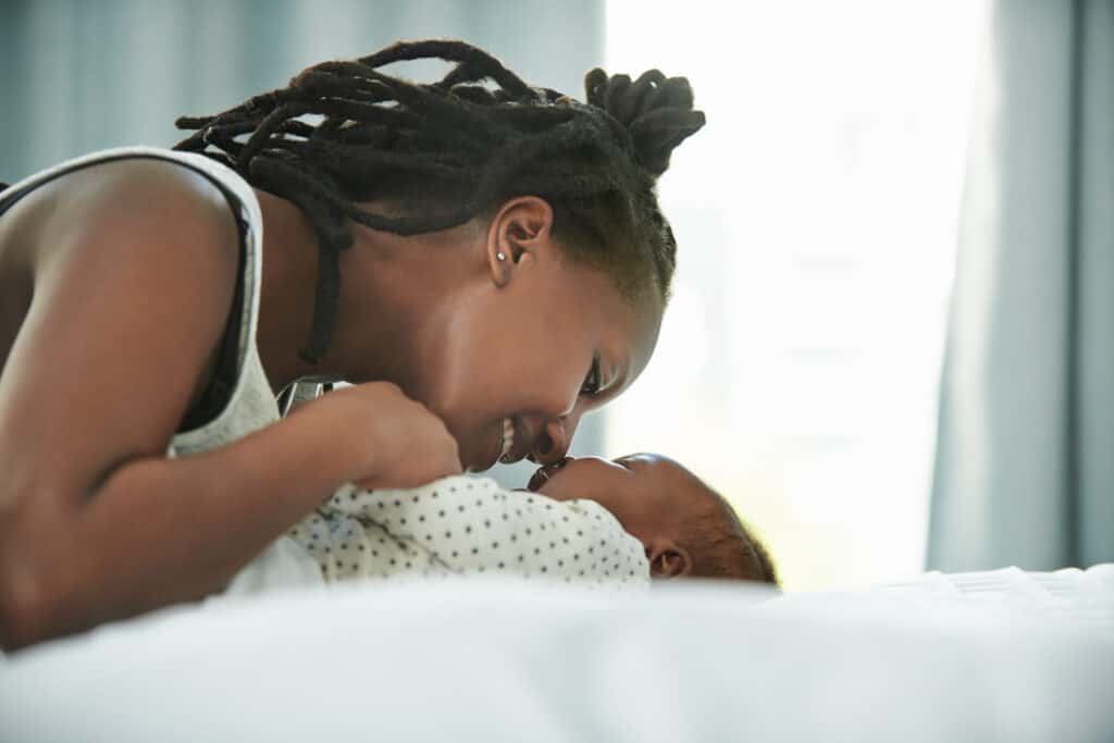 Shot of a mother and her newborn baby at home