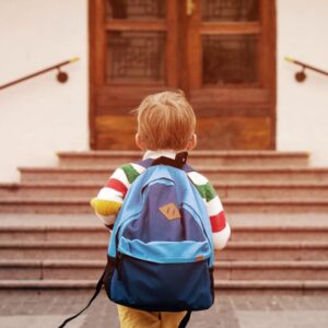 Child walking into a school