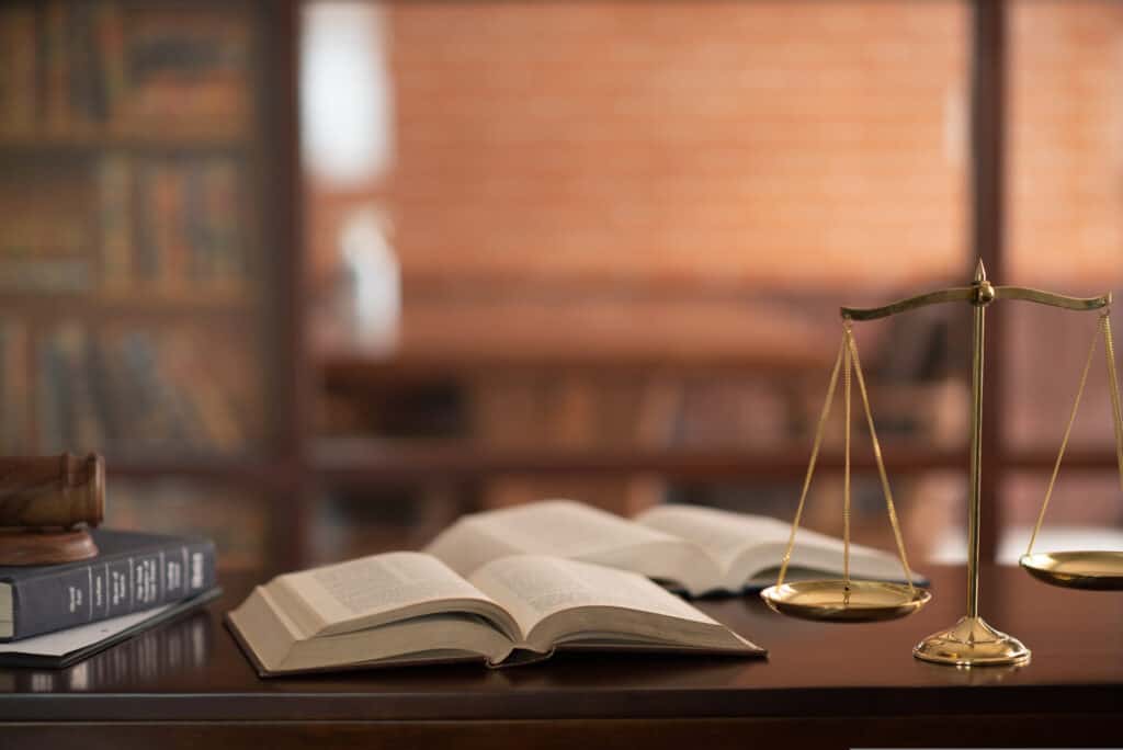 Books and government scale on a desk