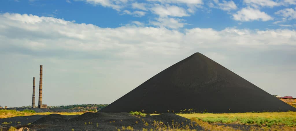 Landscape of a field with a pile a dirt