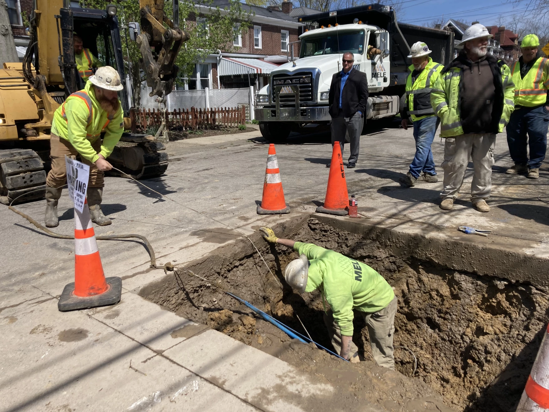 photo of construction workers working on water lines