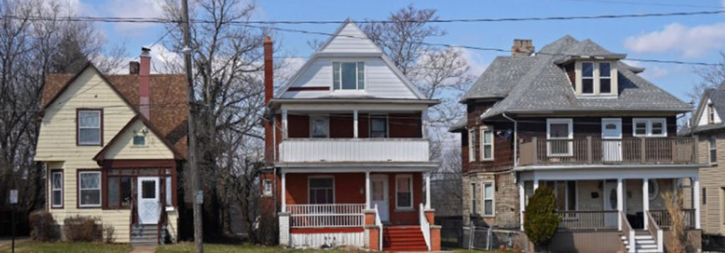 Three homes on a street in Pittsburgh.