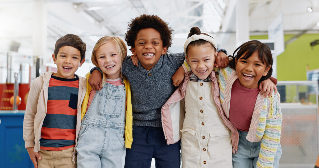 Five children standing next to each other.