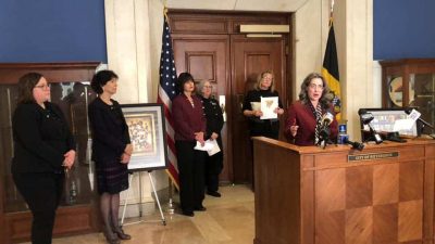 Michelle at a press conference in front of the City of Pittsburgh Council Chambers